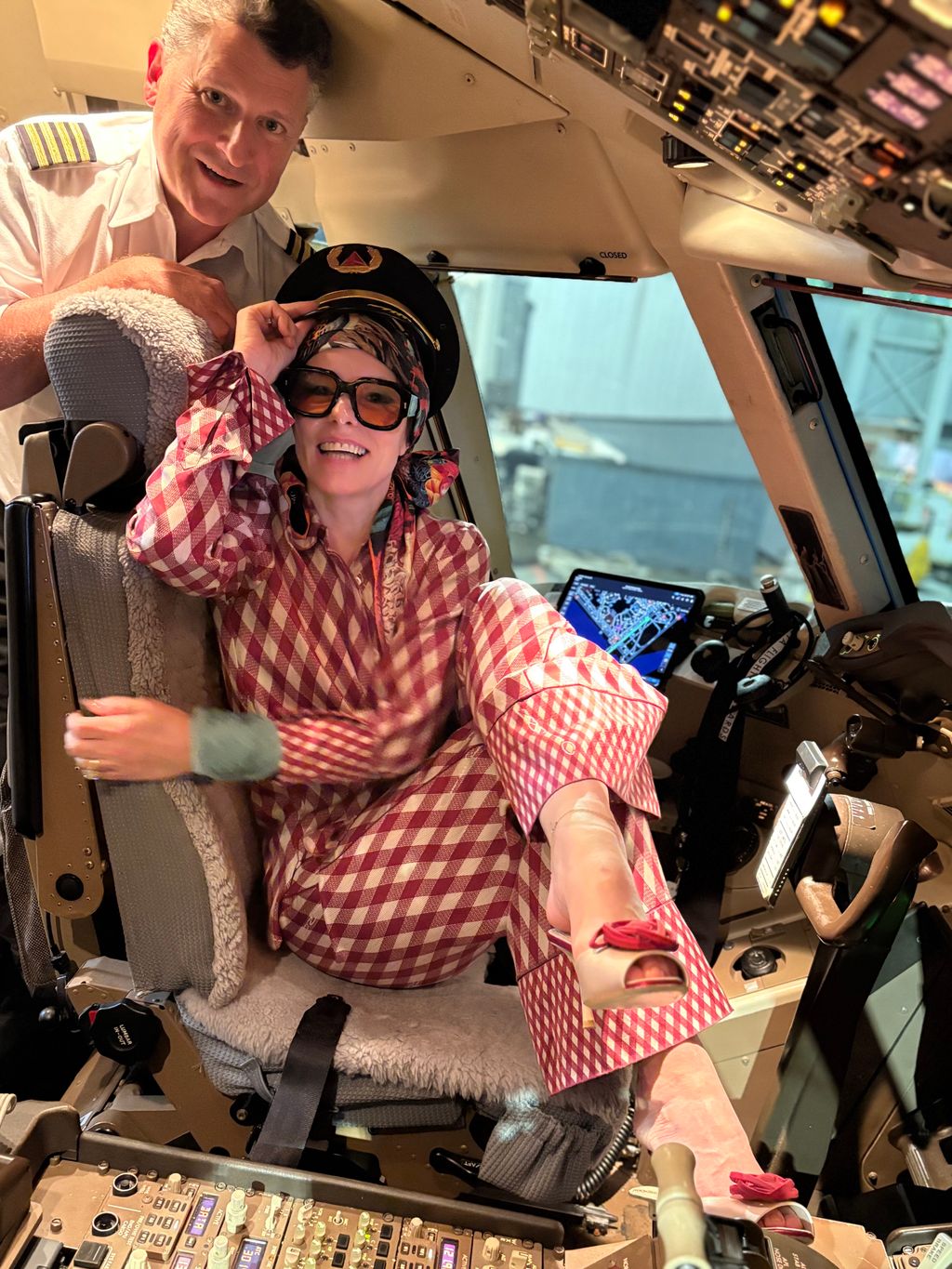 Image may contain Parker Posey Adult Person Aircraft Airplane Transportation and Vehicle