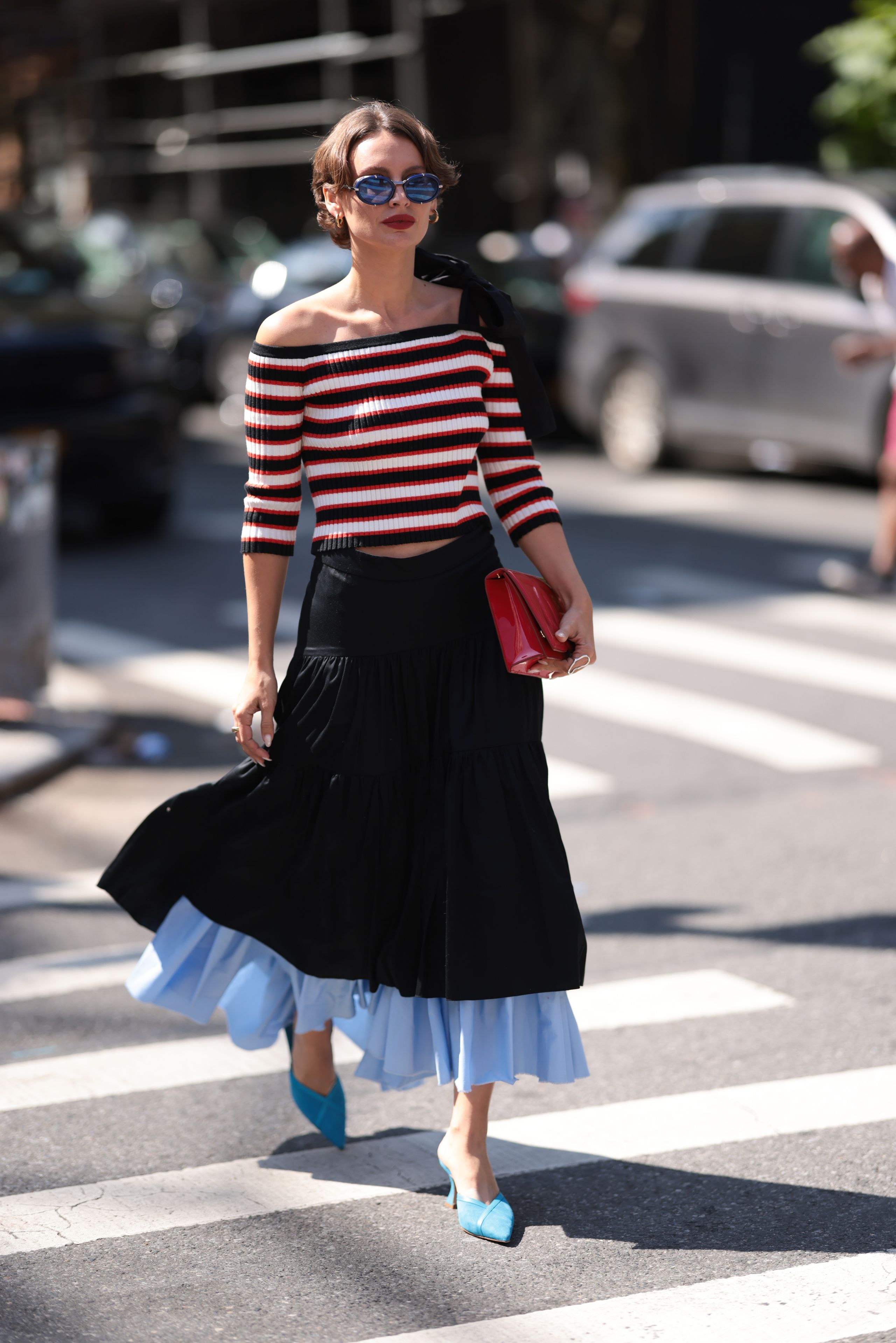 Image may contain Clothing Skirt Pants Adult Person and Pedestrian