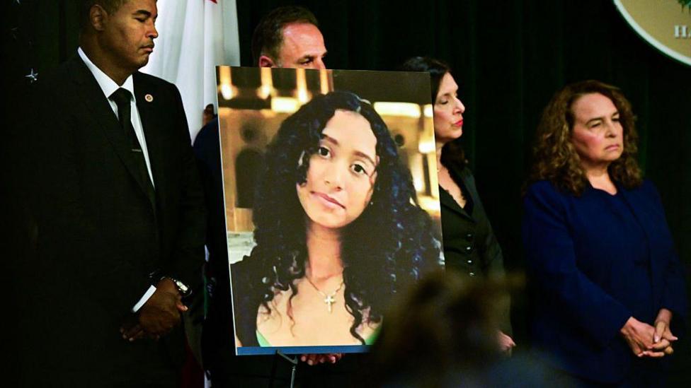 A portrait of the late Celeste Rivas Hernandez is shown during a press briefing by Los Angeles County District Attorney Nathan J. Hochman (out of frame) on the case against singer D4vd in Los Angeles, on April 20, 2026.
