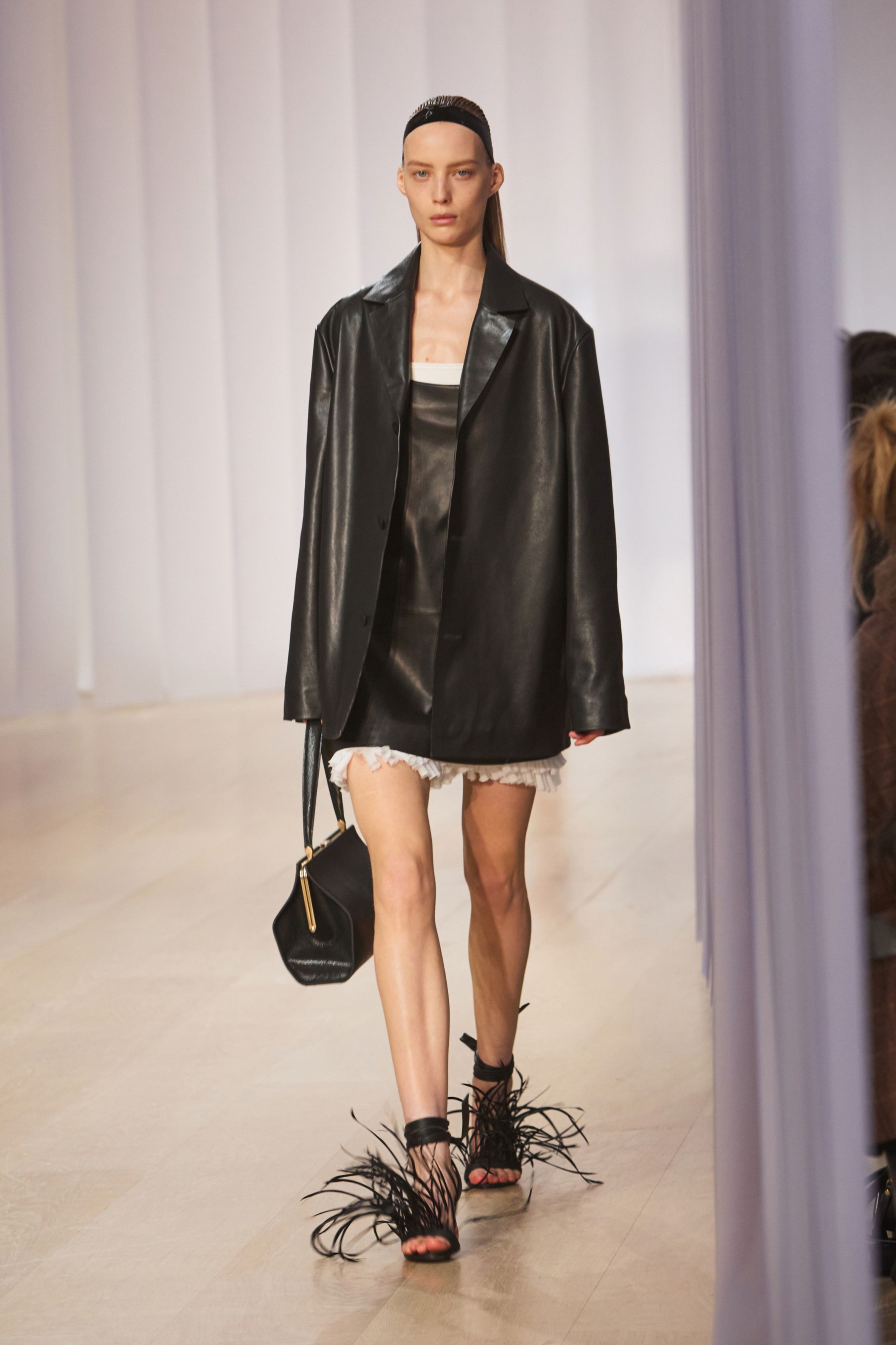 Image may contain Clothing Coat Jacket Fashion Cape Adult Person Footwear and Shoe