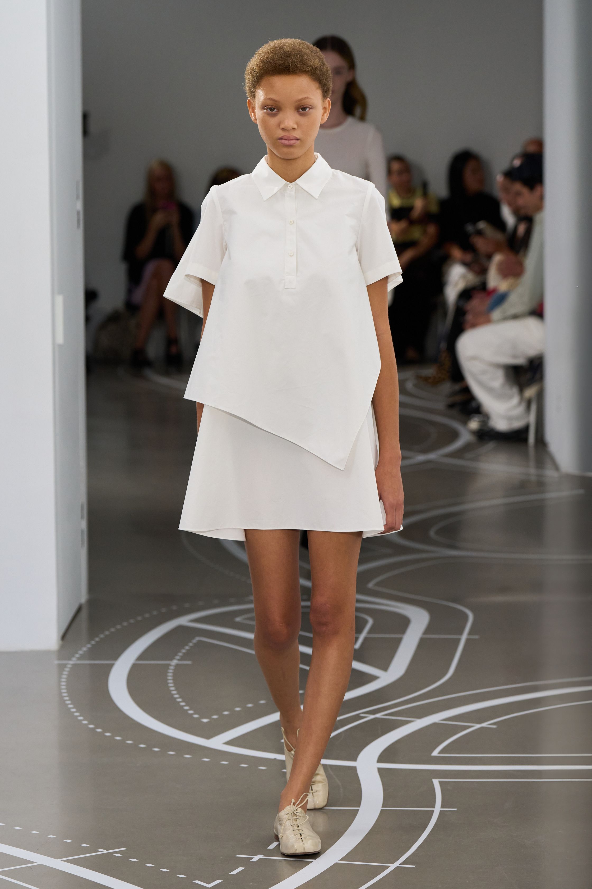 Image may contain Tim O'Brien Clothing Sleeve Person Dress Fashion Blouse Adult Skirt Formal Wear and Runway