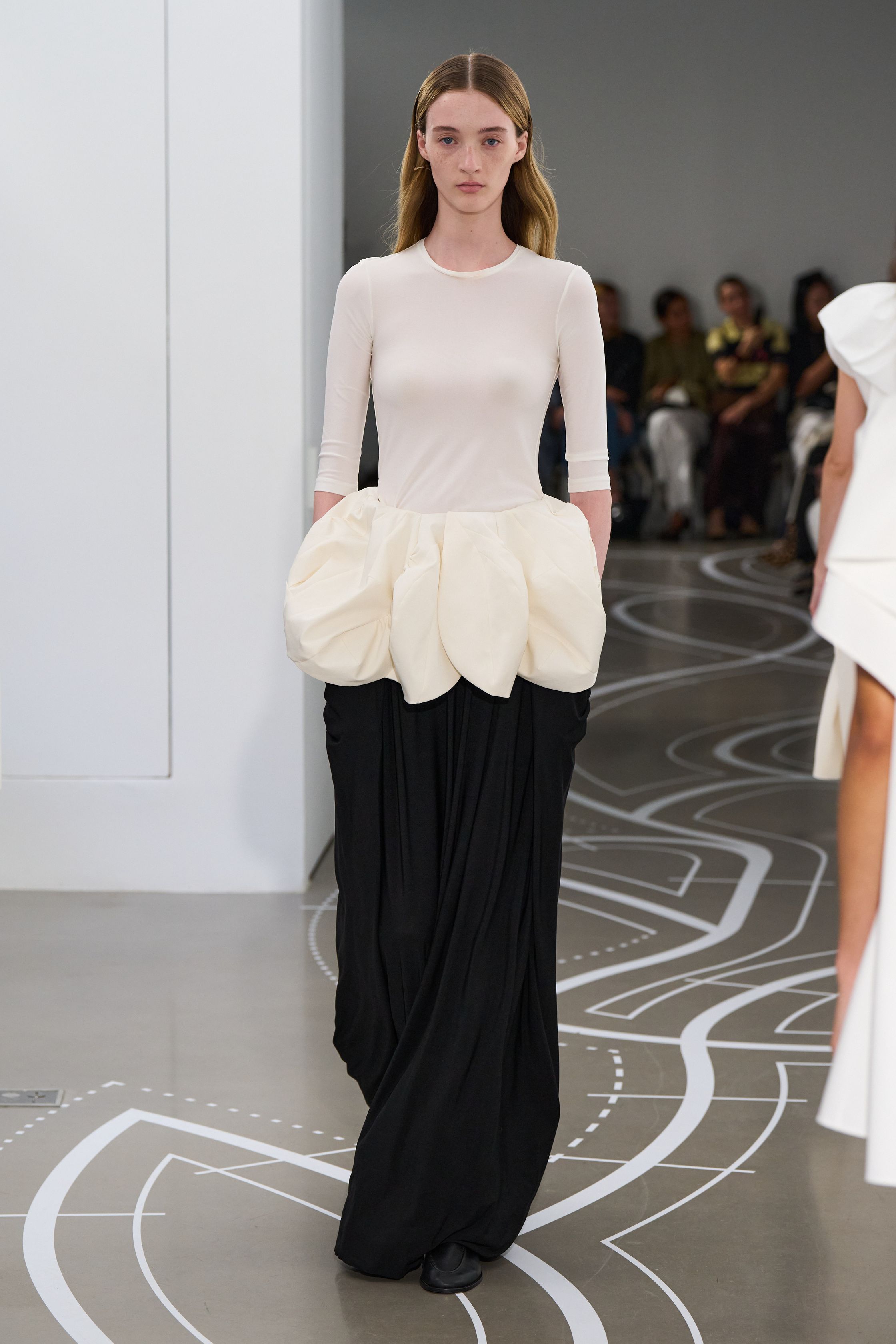 Image may contain Clothing Skirt Long Sleeve Sleeve Dress Adult Person Blouse Formal Wear and Evening Dress
